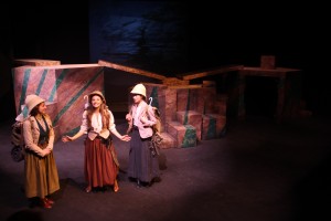 student actors singing and performing on stage