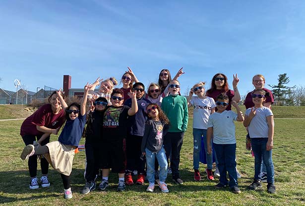 group of students posing for photo outdoors