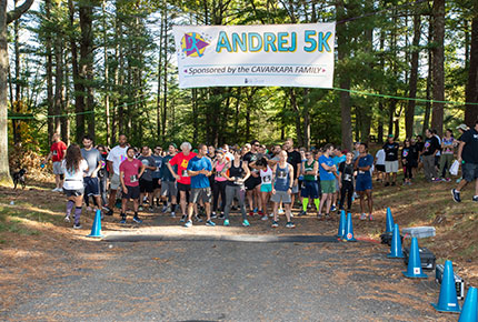 racers lining up at the starting line of the Andrej 5K race