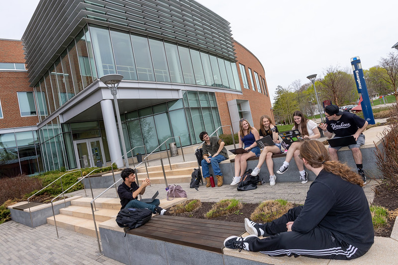 students sitting and chatting in front of the FAIC