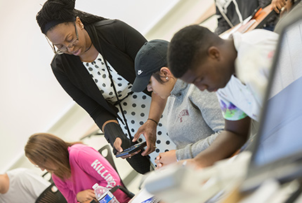 professor helping students during class