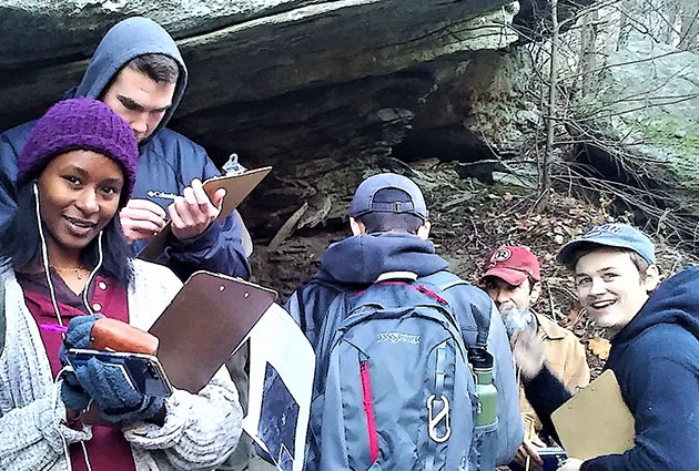 students taking notes and posing for photo