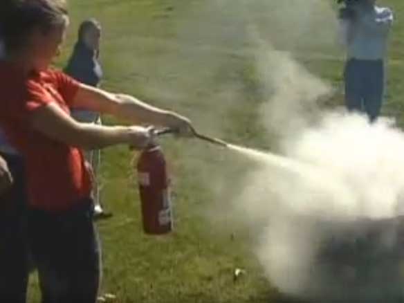 students in extinguisher training