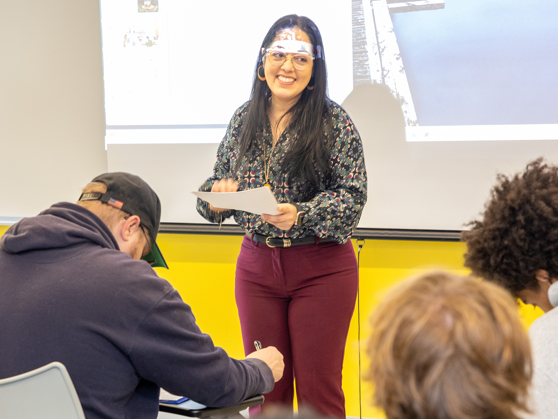 Dimaris Barrios Beltran teaching in front of class