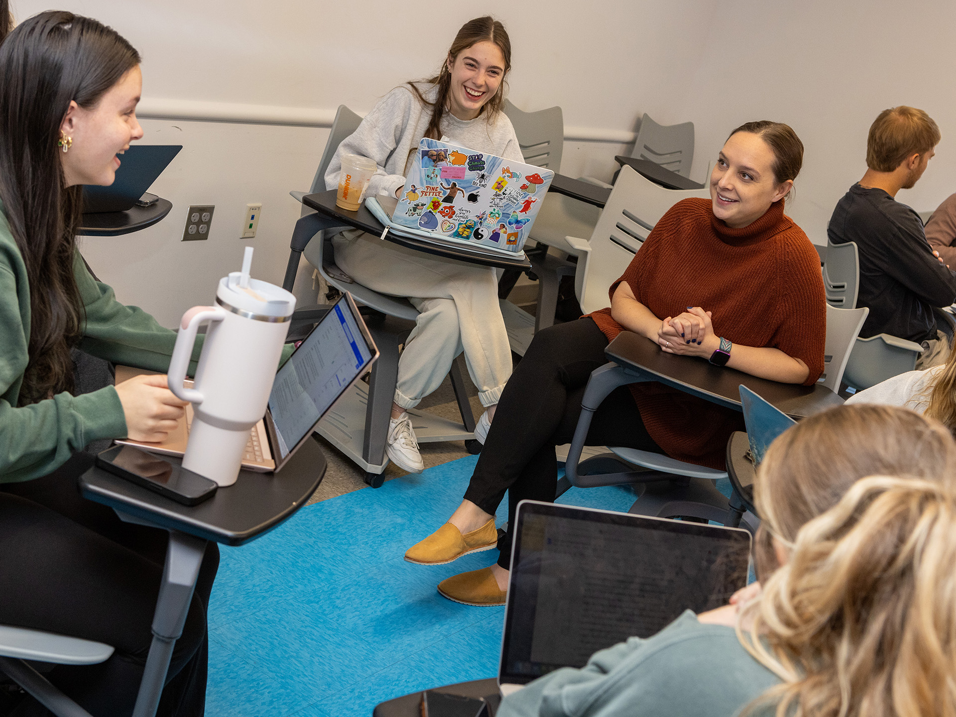 Courtney Broscious talking with students during class