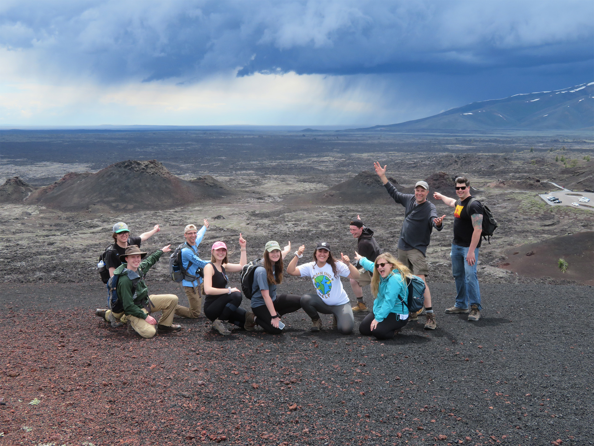 Peter Drzewiecki posing with students during a field trip