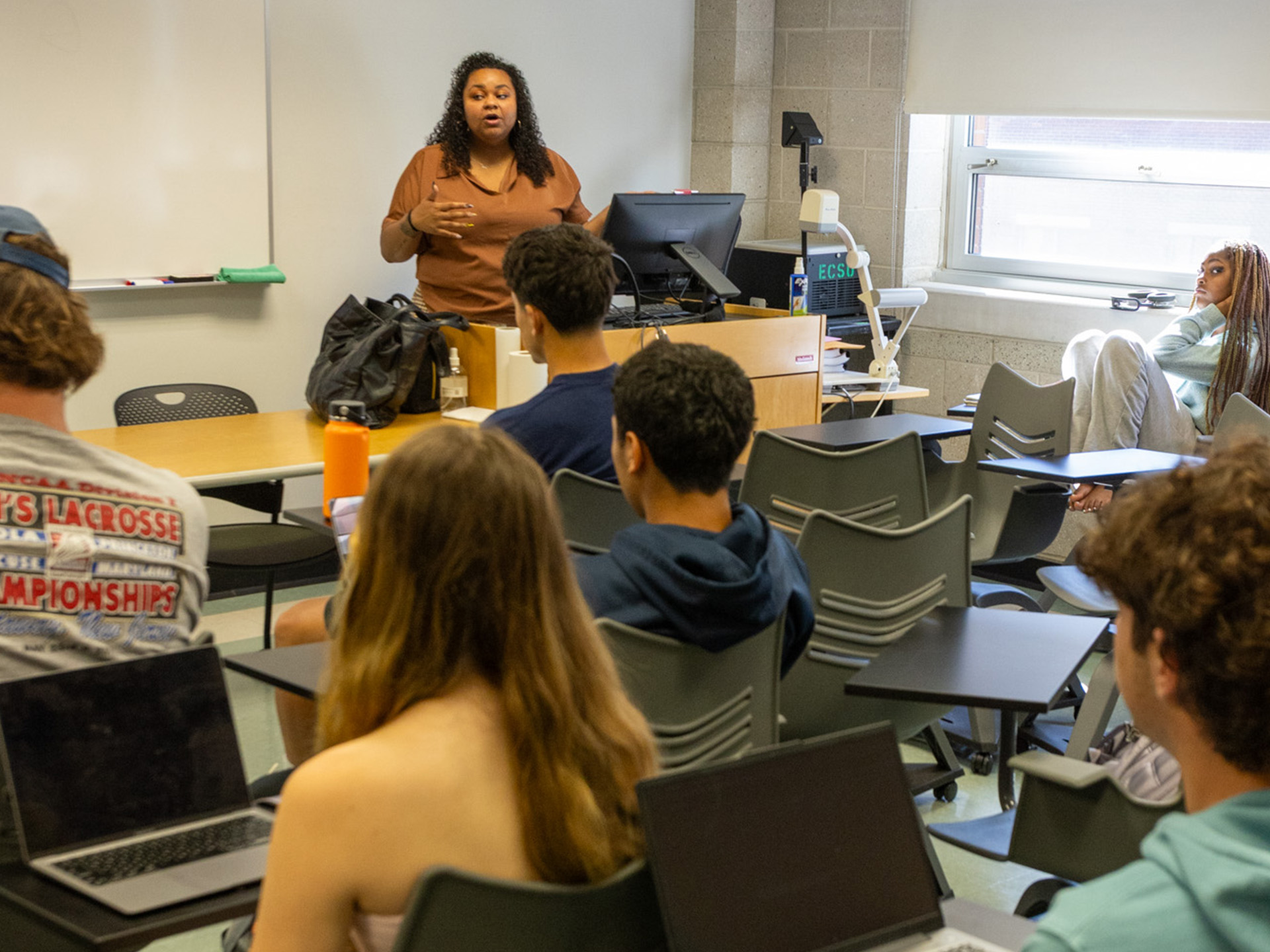 Carol Ann Jackson teaching in front of class