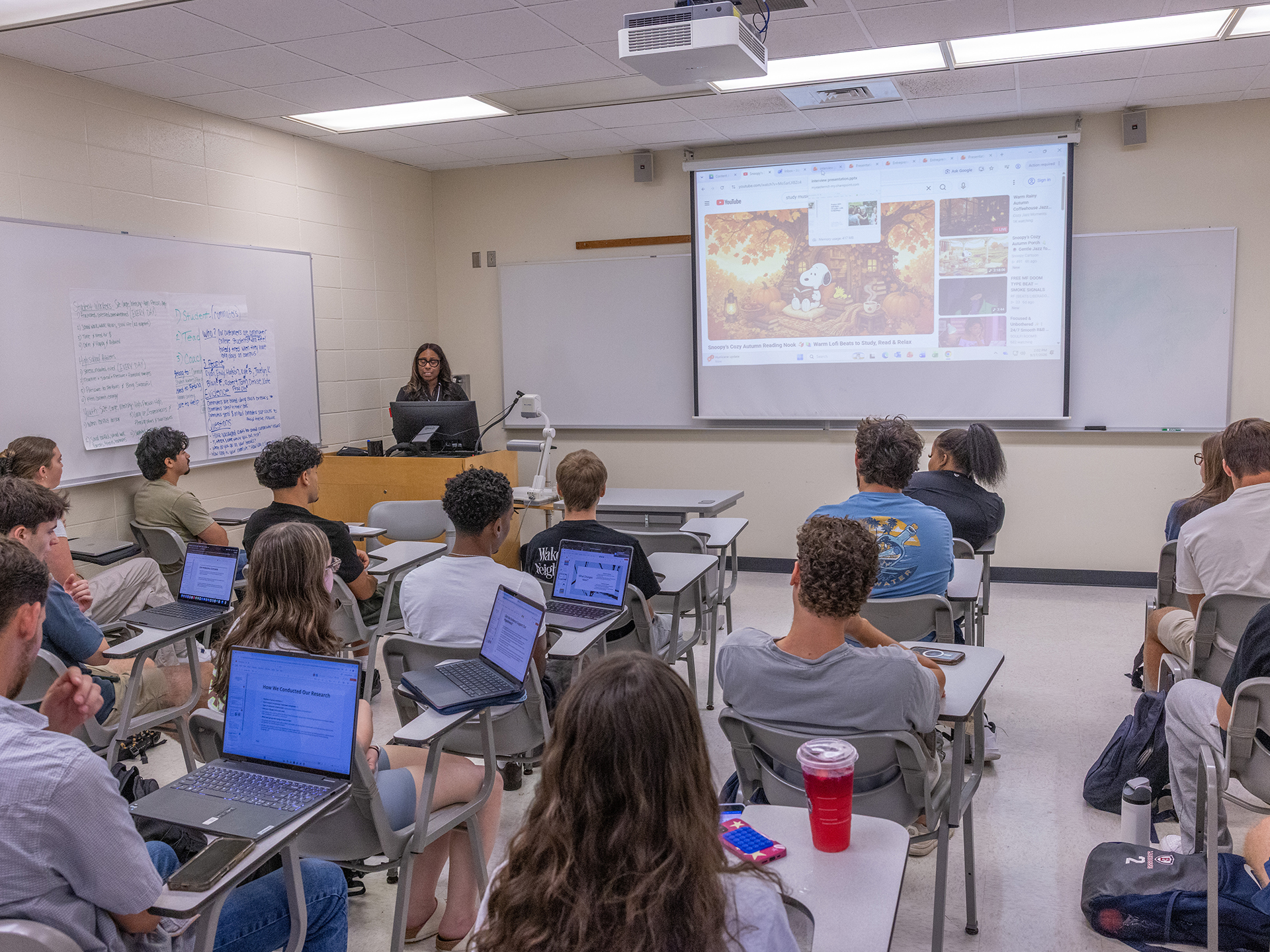 Laquita Joyner-McGraw speaking in front of a classroom full of students