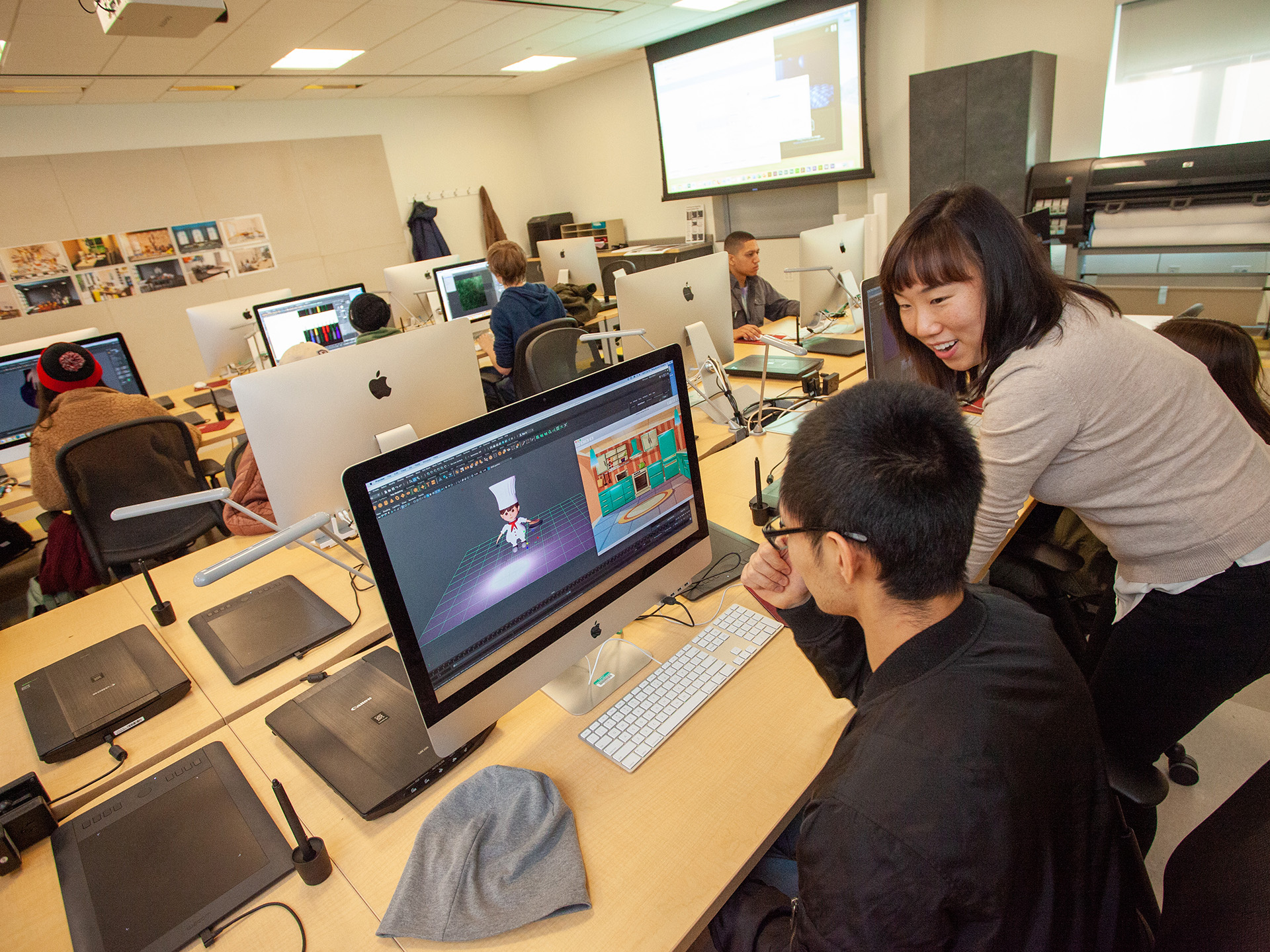 Lora Lee working with a student during class