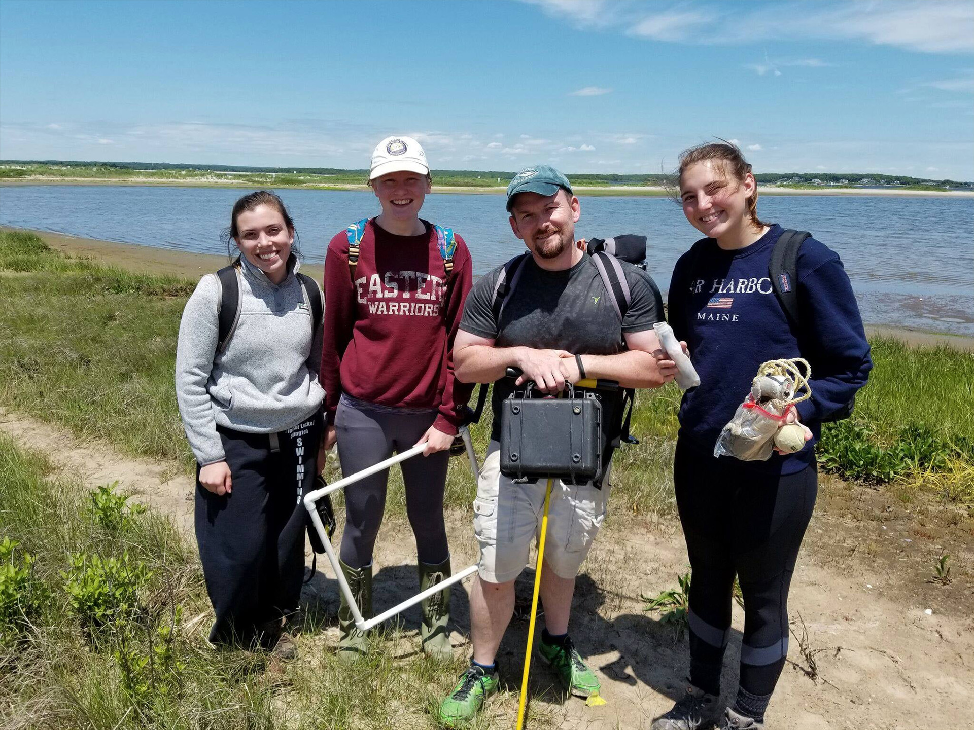 Bryan Oakley posing for a photo with students