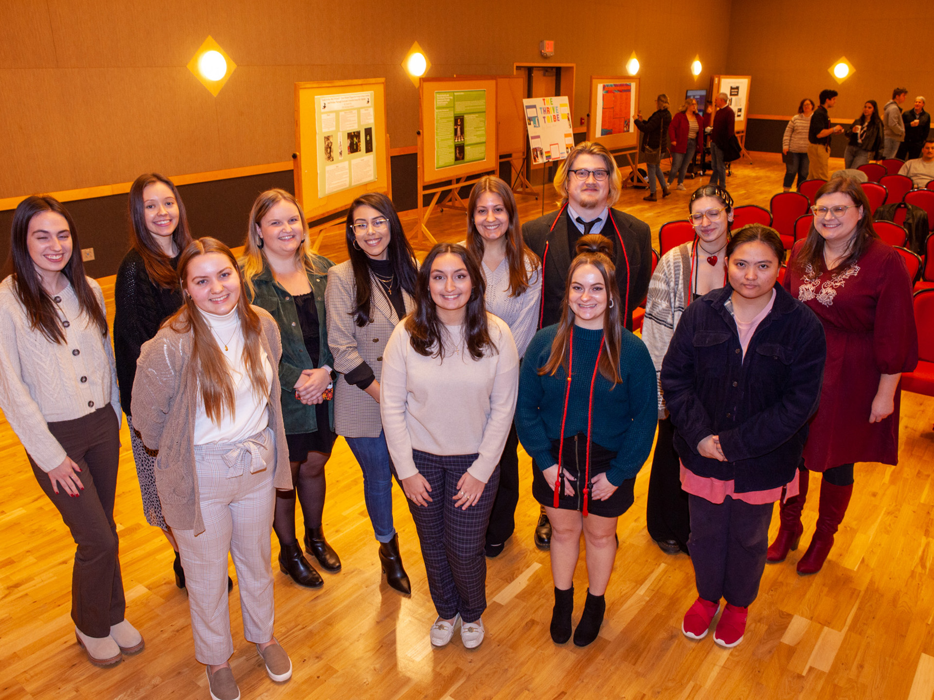 Allison Speicher posing for photo with students