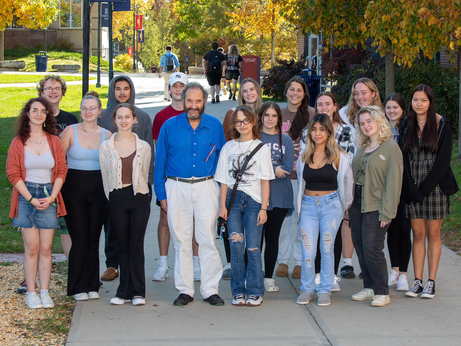 David Stoloff posing for photo with students