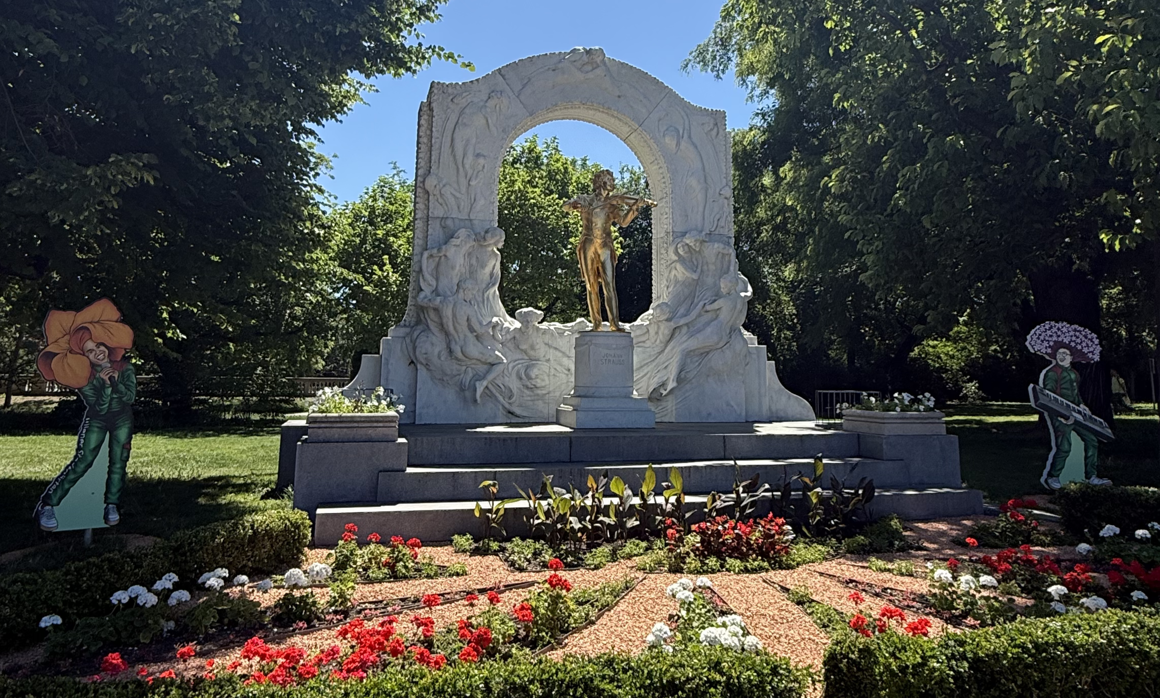 golden statue within a garden