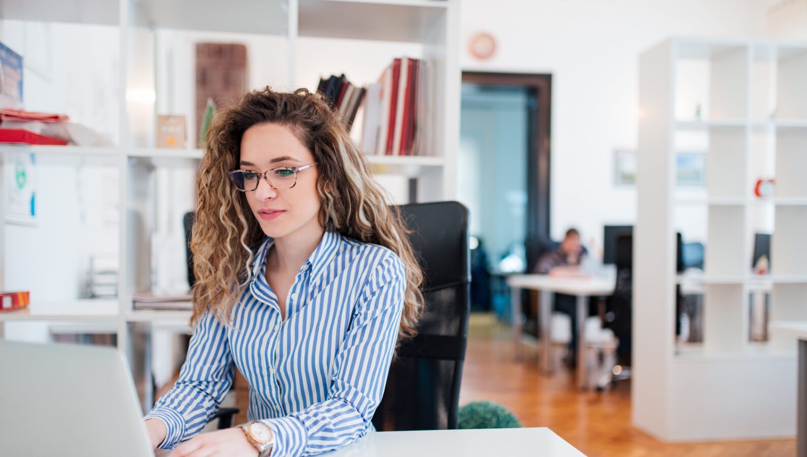 Female accounting professional working in an office space.