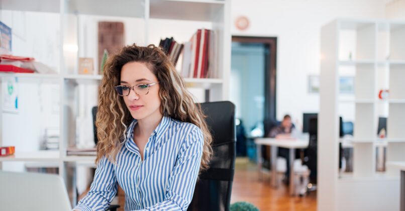 Female accounting professional working in an office space.