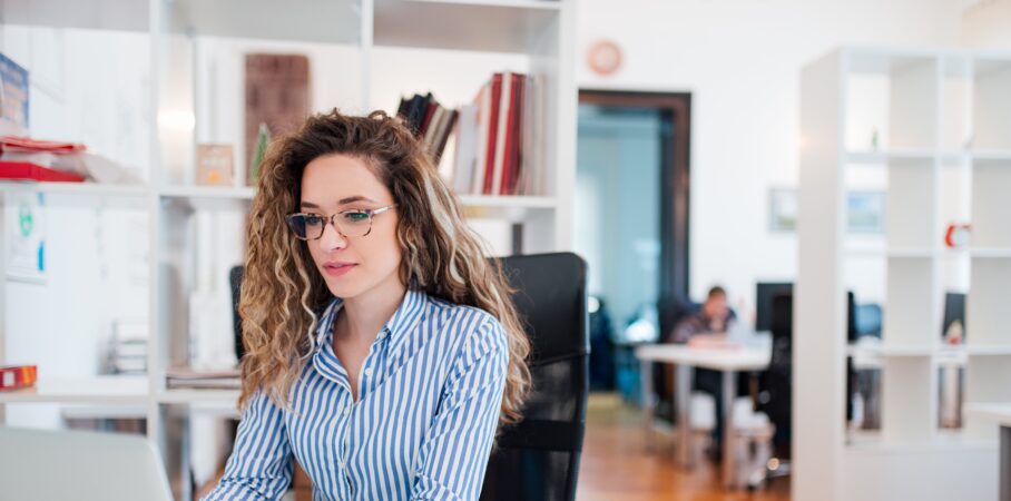 Female accounting professional working in an office space.