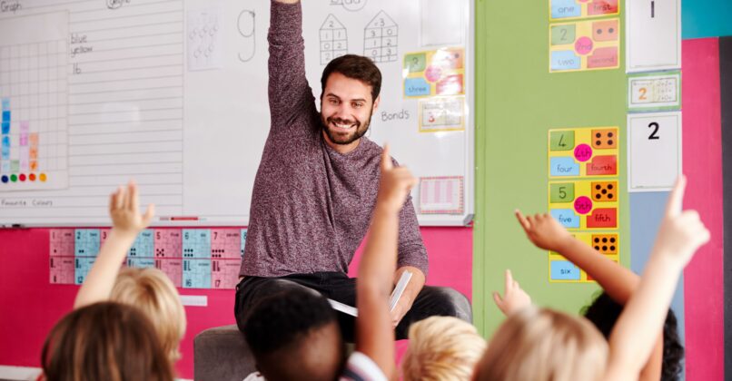 Teacher reading to students in classroom.