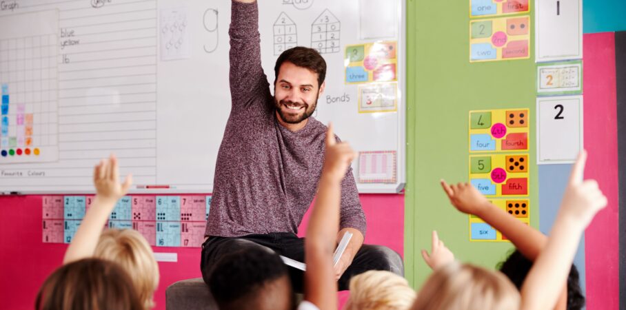 Teacher reading to students in classroom.