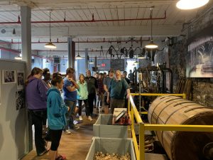 Dr. Jamie Eves with students at the Mill Museum