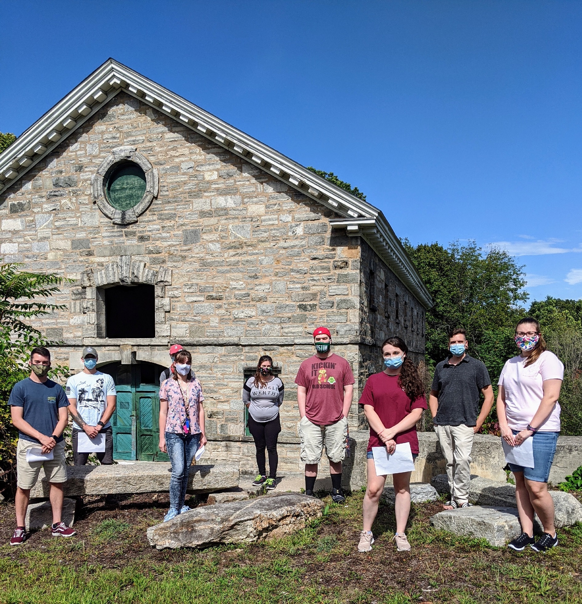 Students in front of a historic mill