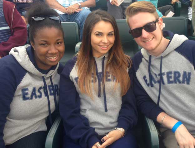 three students at sports event