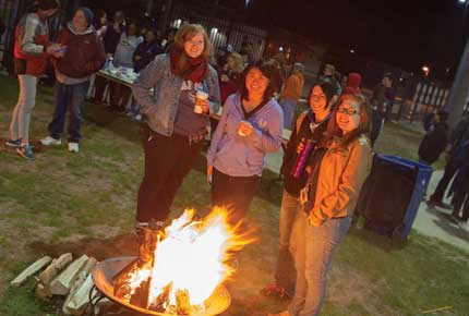 students around a fire