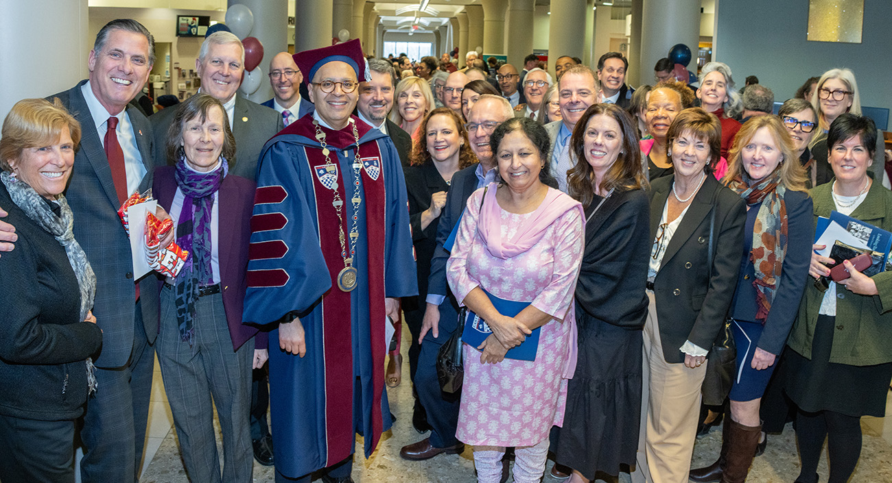 President Ismaili posing for a photo with members of the Eastern community