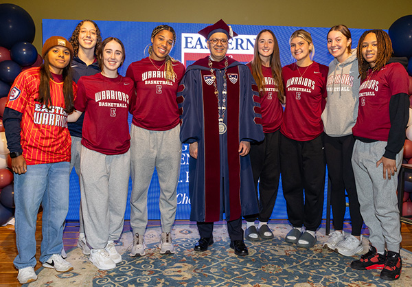 President Ismaili posing for photo with students after the Inauguration