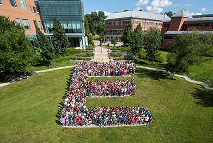 students forming a large E on the campus lawn