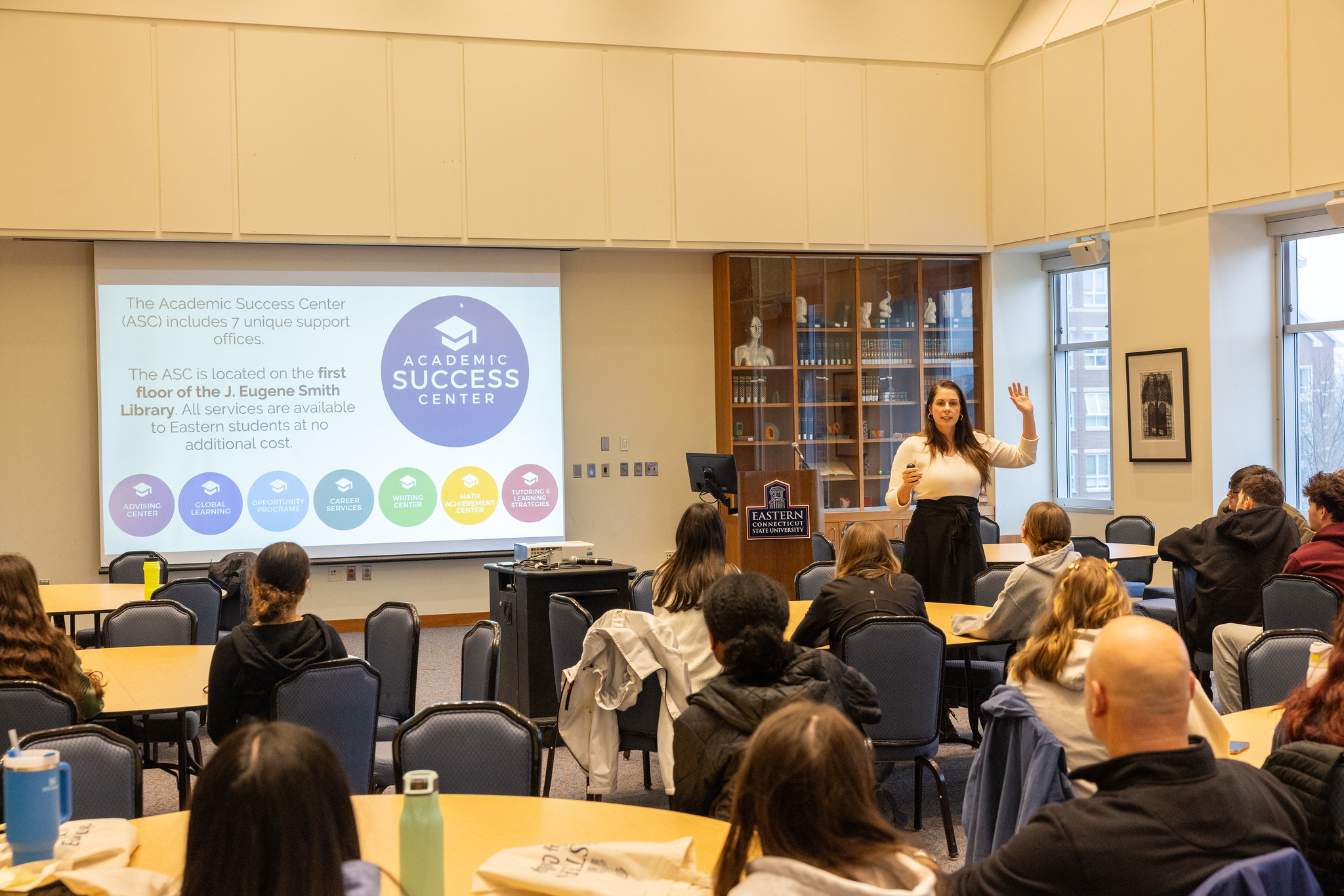 A presenter introducing the Academic Success Center to students and families