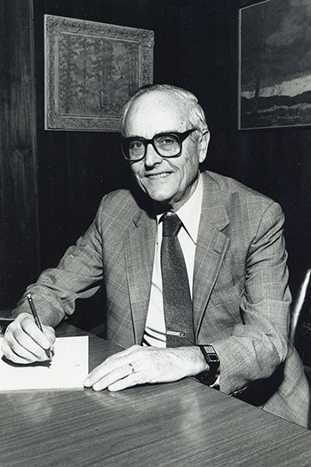 Webb at desk