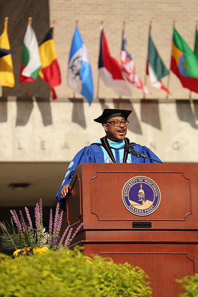 Gibson speaking at the University of Wisconsin-Stevens Point commencement. 