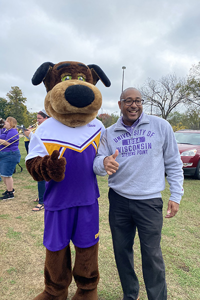 Gibson with University of Wisconsin-Stevens Point mascot, Stevie Pointer. 