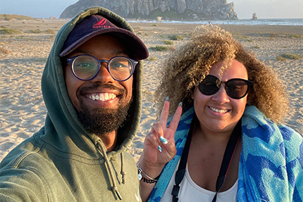 couple at beach posing for photo