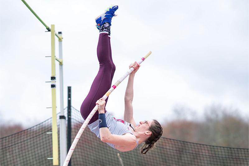 Junior Natasha Frisch ’25 pole vaulting