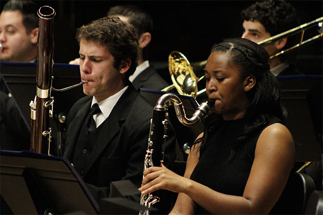 Students playing instruments in the orchestra