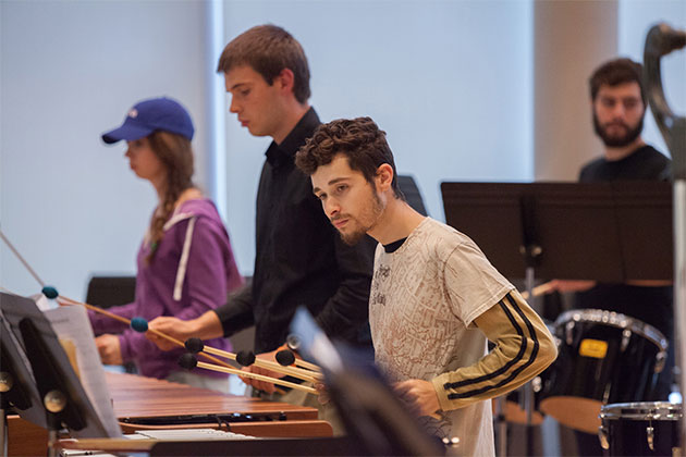 Student musicians playing instruments