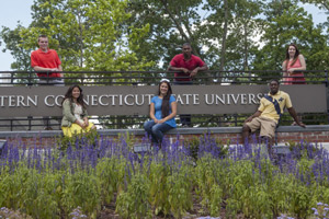 Eastern students pose at Eastern entrance