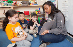 Jeniel Edmons an eastern students reads to the children in the program.