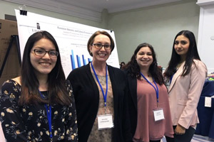 Antuanett Ortiz, Professor Jennifer Leszczynski, Joanna Casuccio and Alyssa Sokaitis present at Association for Women in Psychology.