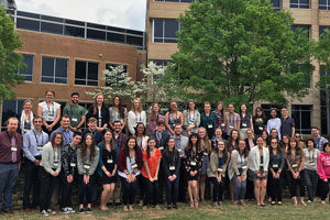 43 student presenters pose for the camera.