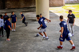 Christian Dontae playing soccer with the Doc Wayne program.