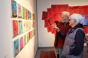 Gallery patrons view Maknojia’s work.