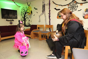 A child dressed as mini mouses trick-o-treats