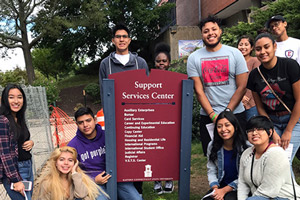 First generation themed housing students pose for a photo.