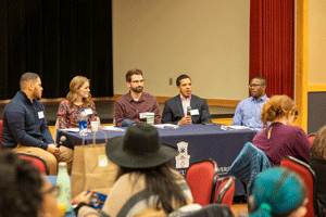 Employers sit at a table and talk about career development