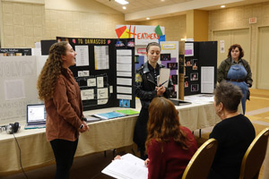 Katelynn Scalia and SJ Reynolds presenting.