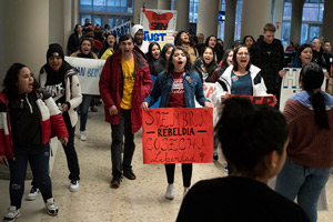 Students chant across the student center.