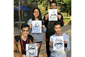 Eastern students hold their caricature drawings. 