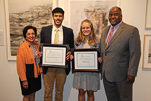 Barnard Scholars Nelson Javier Santos Ferrer and Natalie Devlin stand beside Eastern President Elsa Núñez and Todd Cooper, CSCSU board member and management program analyst with the U.S. Office of Personnel Management.